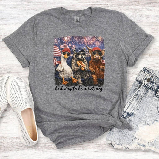 funny july 4th hot dog graphic tee with goose raccoon cow design